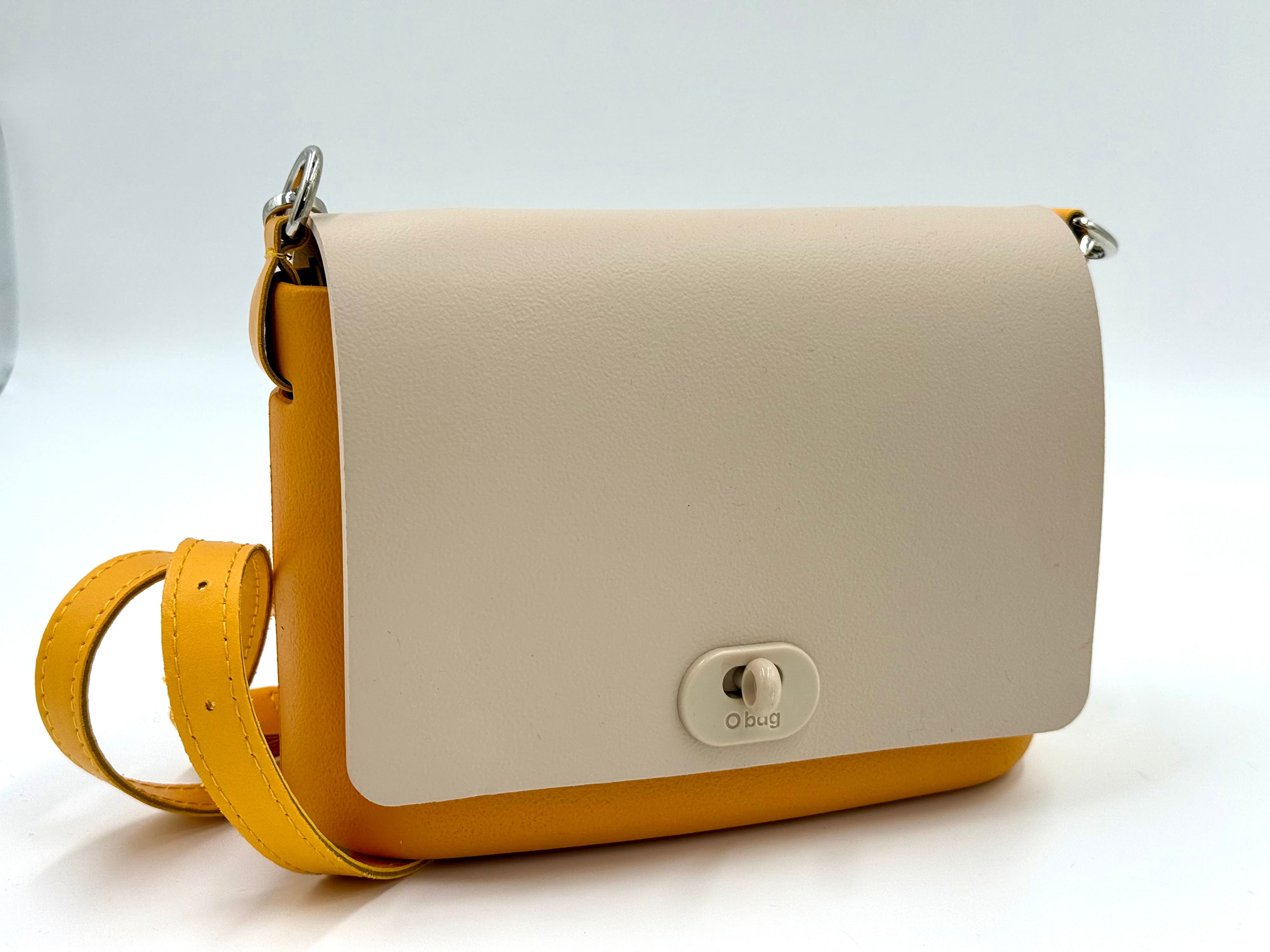 O bag Pocket mini bag – yellow body, off-white lid, twist lock, yellow strap
