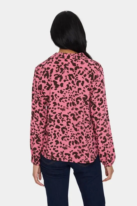 Back view of the Saint Tropez EDASZ pink animal print blouse on a model, showing the long sleeves, straight fit and curved hem.