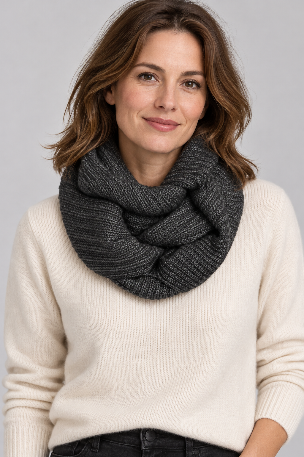 Model wearing an s.Oliver charcoal grey ribbed snood with a cream jumper against a neutral studio background
